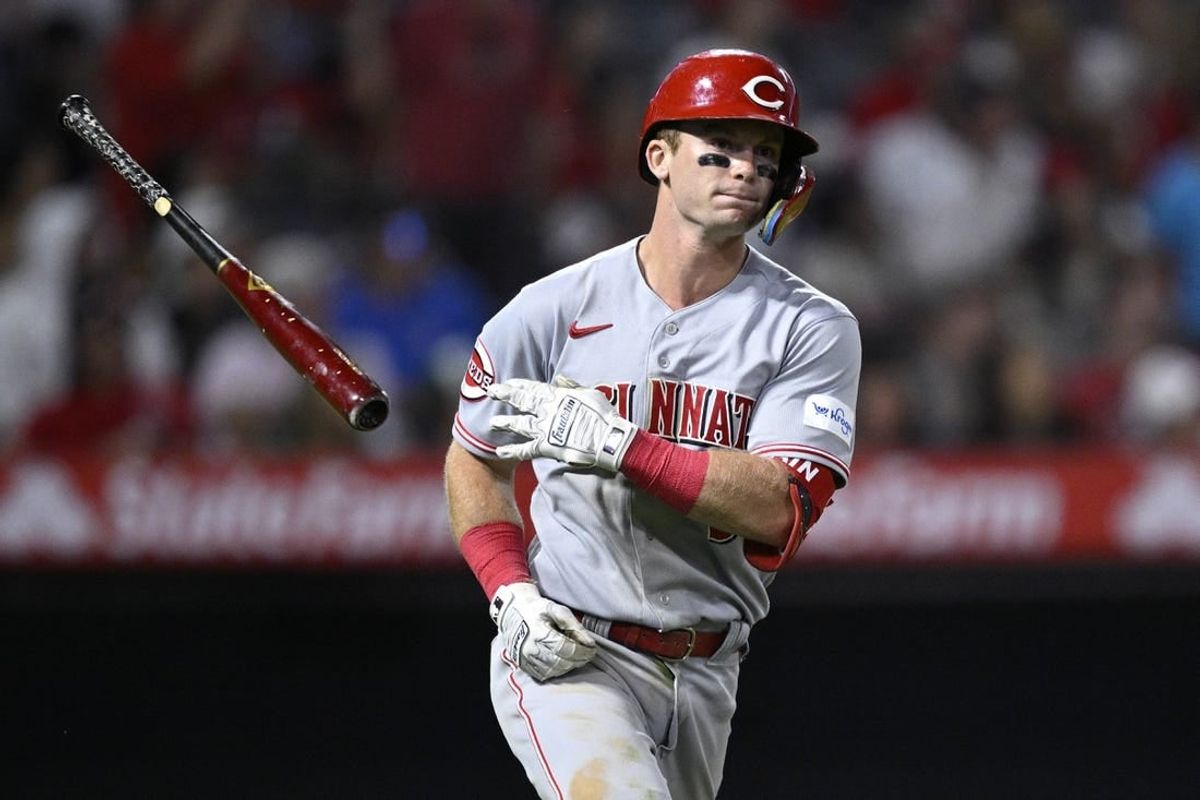 Aug 23, 2023; Anaheim, California, USA; Cincinnati Reds second baseman Matt McLain (9) tosses his bat after hitting a two-run home run against the Los Angeles Angels during the eighth inning at Angel Stadium.