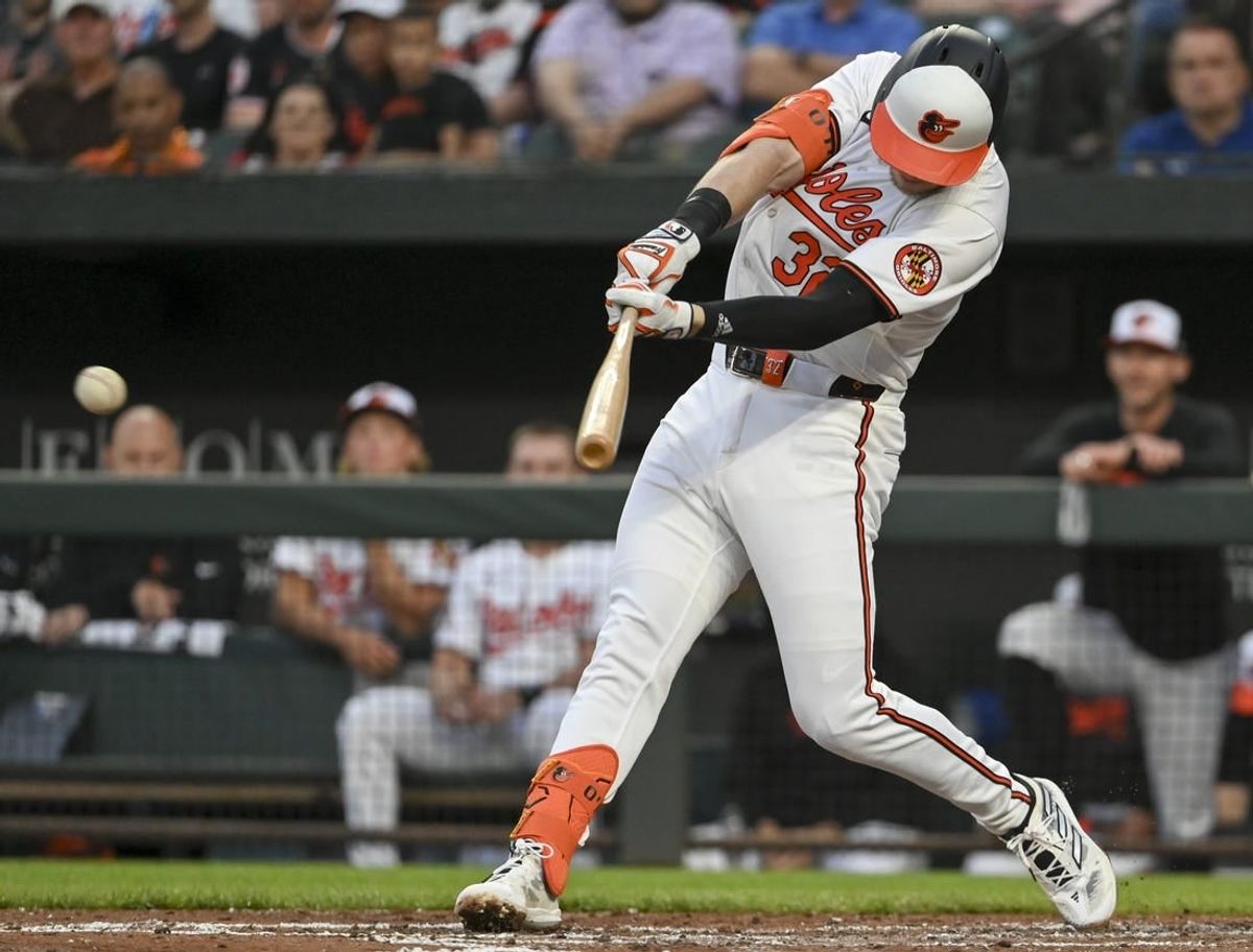 Apr 16, 2024; Baltimore, Maryland, USA;  Baltimore Orioles first baseman Ryan O'Hearn (32) hits a third inning single against the Minnesota Twins at Oriole Park at Camden Yards.