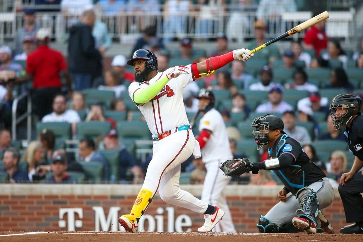 Apr 24, 2024; Atlanta, Georgia, USA; Atlanta Braves designated hitter Marcell Ozuna (20) hits a RBI single against the Miami Marlins in the first inning at Truist Park.