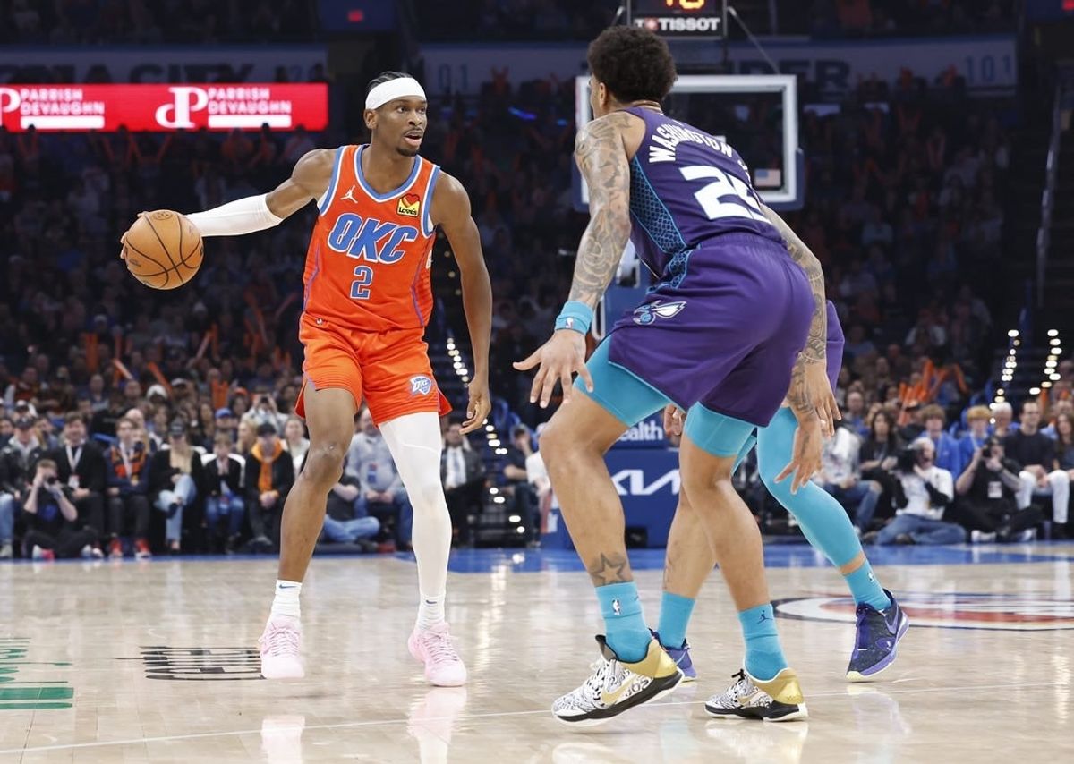 Feb 2, 2024; Oklahoma City, Oklahoma, USA; Oklahoma City Thunder guard Shai Gilgeous-Alexander (2) moves down the court against Charlotte Hornets forward P.J. Washington (25) during the second quarter at Paycom Center.