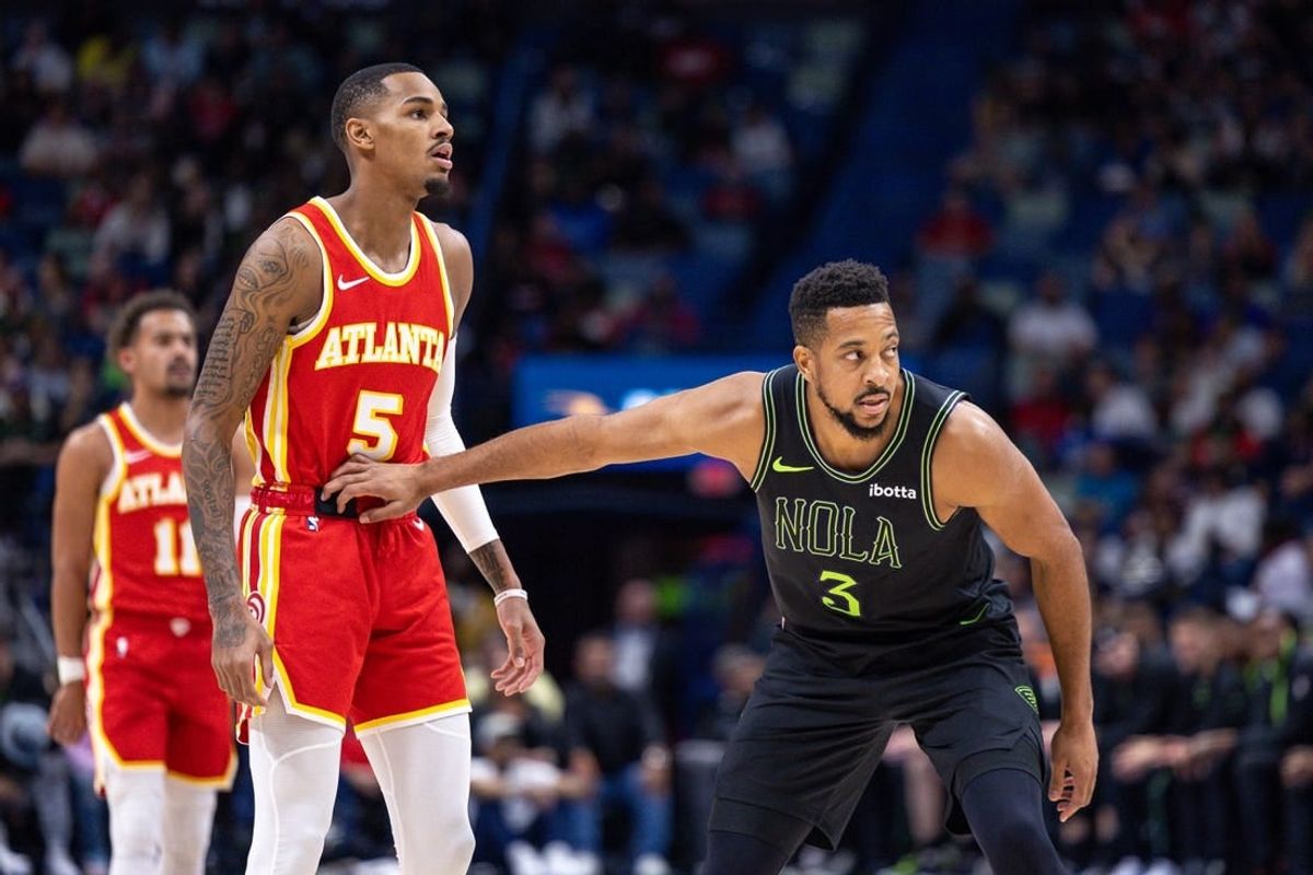 Nov 4, 2023; New Orleans, Louisiana, USA; New Orleans Pelicans guard CJ McCollum (3) guards Atlanta Hawks guard Dejounte Murray (5) during the first half at Smoothie King Center.