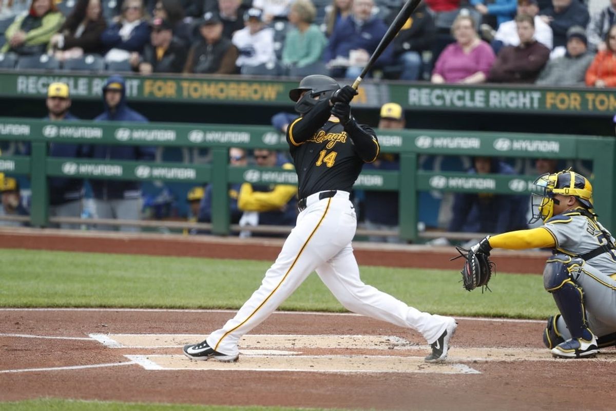 Apr 25, 2024; Pittsburgh, Pennsylvania, USA;  Pittsburgh Pirates catcher Joey Bart (14) hits a three run home run against the Milwaukee Brewers during the first inning at PNC Park.