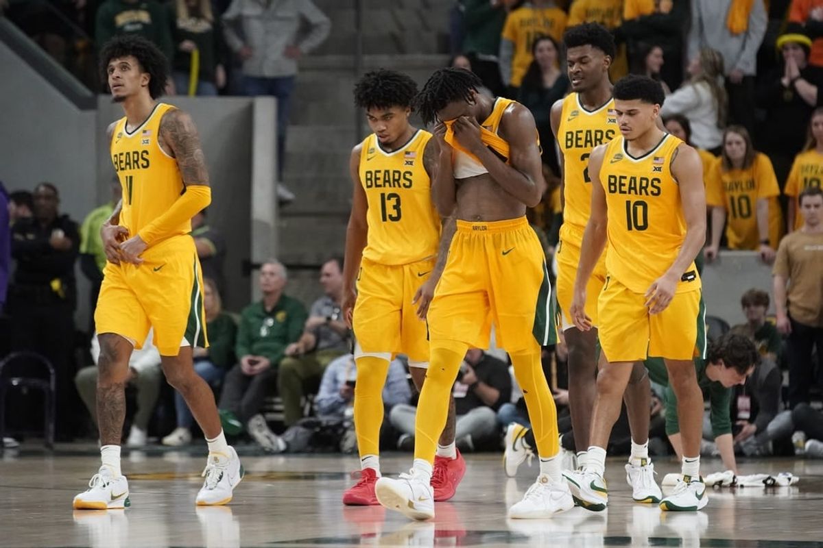 Jan 27, 2024; Waco, Texas, USA; Baylor Bears guard Ja'Kobe Walter (4) and teammates walk to the bench after a flagrant foul in TCU during the third overtime at Paul and Alejandra Foster Pavilion.