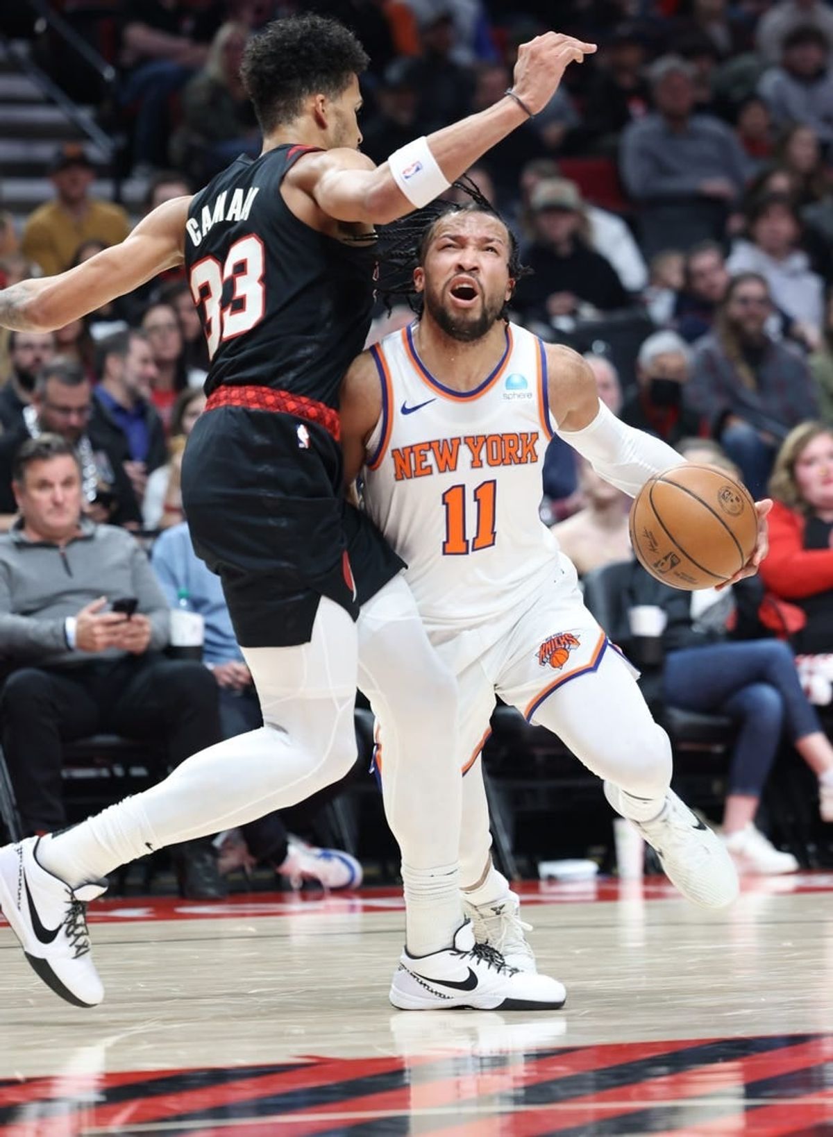 Mar 14, 2024; Portland, Oregon, USA; New York Knicks guard Jalen Brunson (11) reacts after being fouled by Portland Trail Blazers forward Toumani Camara (33) in the third quarter at Moda Center.