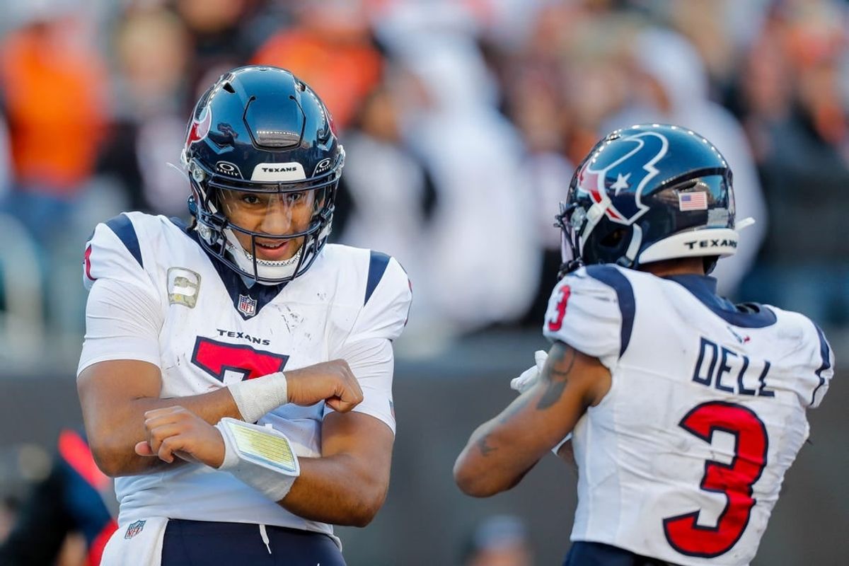 Nov 12, 2023; Cincinnati, Ohio, USA; Houston Texans quarterback C.J. Stroud (7) reacts after scoring a touchdown with wide receiver Tank Dell (3) in the second half against the Cincinnati Bengals at Paycor Stadium.