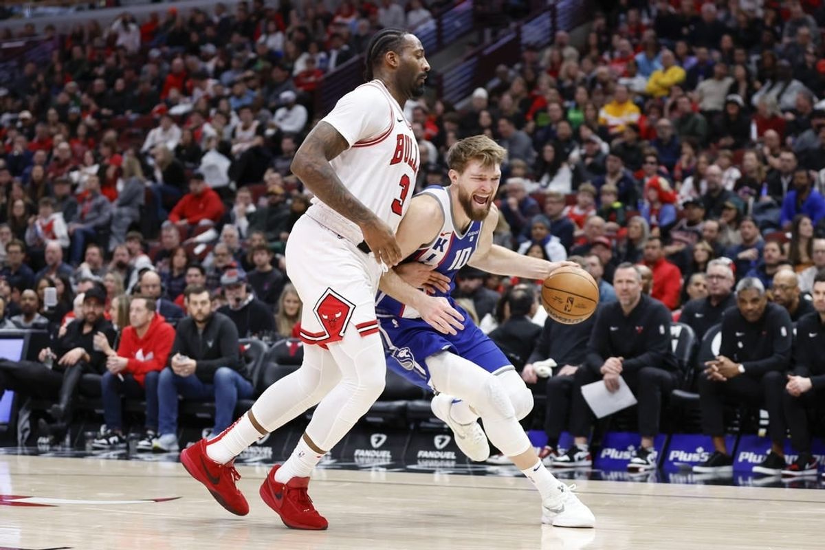 Feb 3, 2024; Chicago, Illinois, USA; Sacramento Kings forward Domantas Sabonis (10) drives to the basket against Chicago Bulls center Andre Drummond (3) during the second half at United Center.