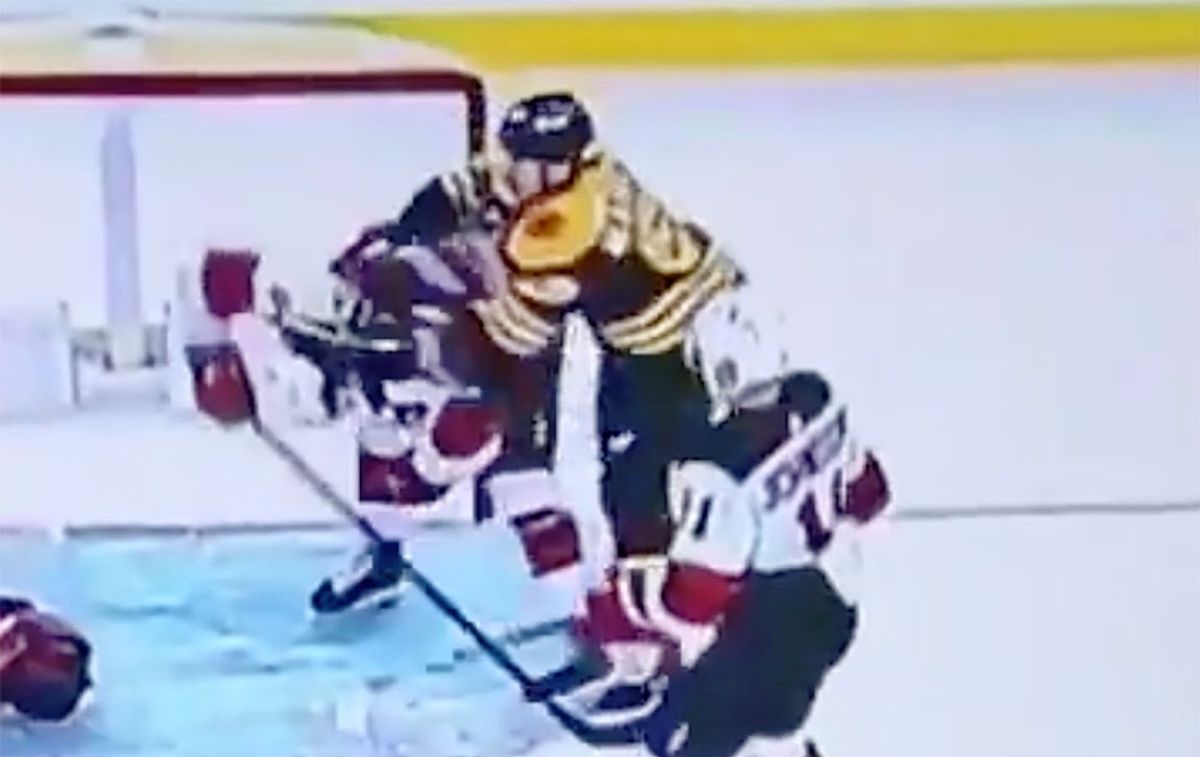 Boston’s Brad Marchand checks  Ty Smith in the head . No whistle.