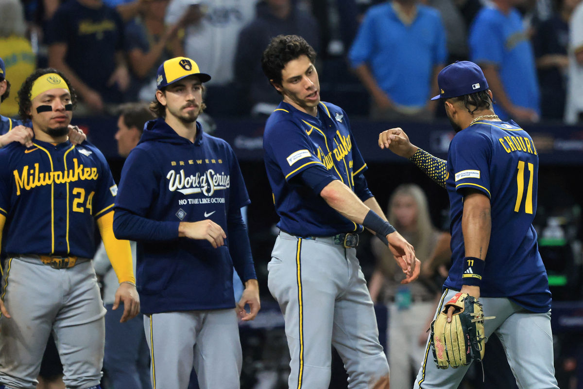 Oct 26, 2026; St. Petersburg, Florida, USA; Milwaukee Brewers outfielder Jackson Chourio (11) celebrates with designated hitter Christian Yelich (22), pitcher Robert Gasser (54) and catcher William Contreras (24) after the last out of the game against the Tampa Bay Rays during the ninth inning in game three of the 2026 World Series at Tropicana Field. Mandatory Credit: Kim Klement Neitzel-Imagn Images