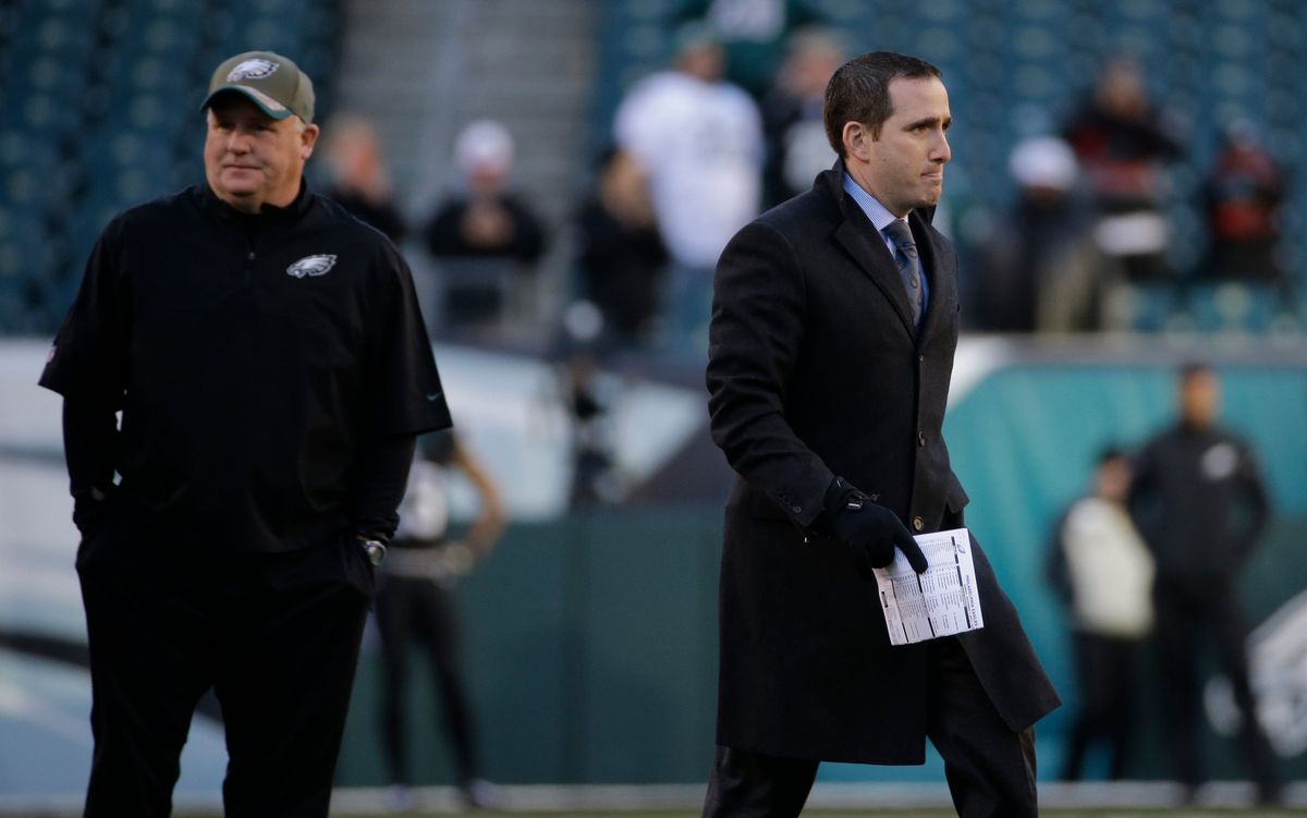 Chip Kelly and Howie Roseman, probably disagreeing about something. (AP Photo/Michael Perez)