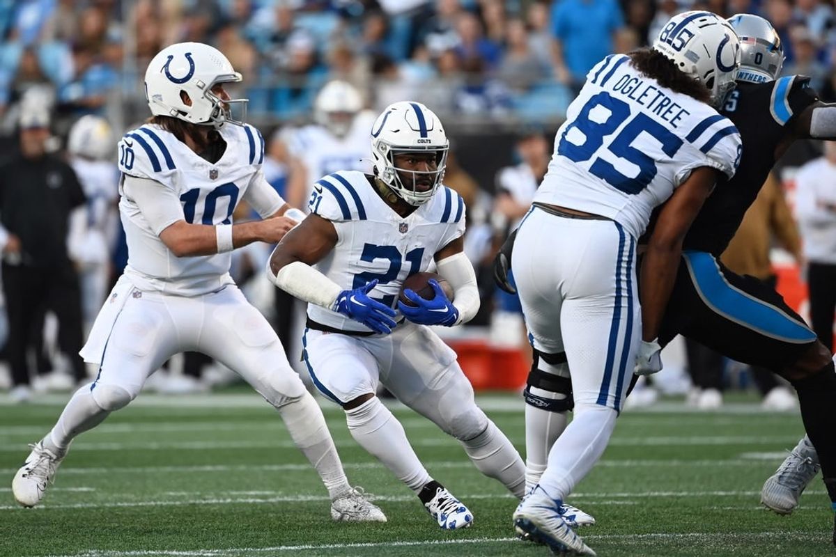 Nov 5, 2023; Charlotte, North Carolina, USA; Indianapolis Colts running back Zack Moss (21) with the ball in the first quarter at Bank of America Stadium.