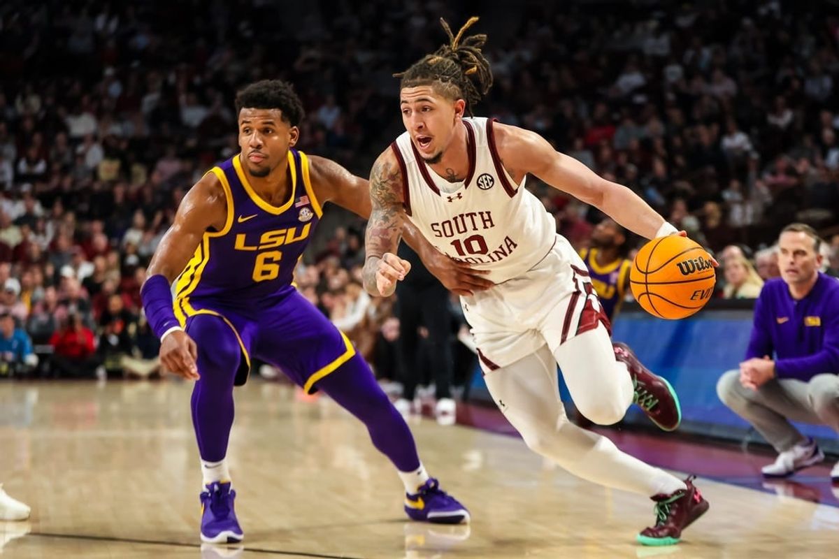 Feb 17, 2024; Columbia, South Carolina, USA; South Carolina Gamecocks guard Myles Stute (10) drives past LSU Tigers guard Jordan Wright (6) in the first half at Colonial Life Arena.