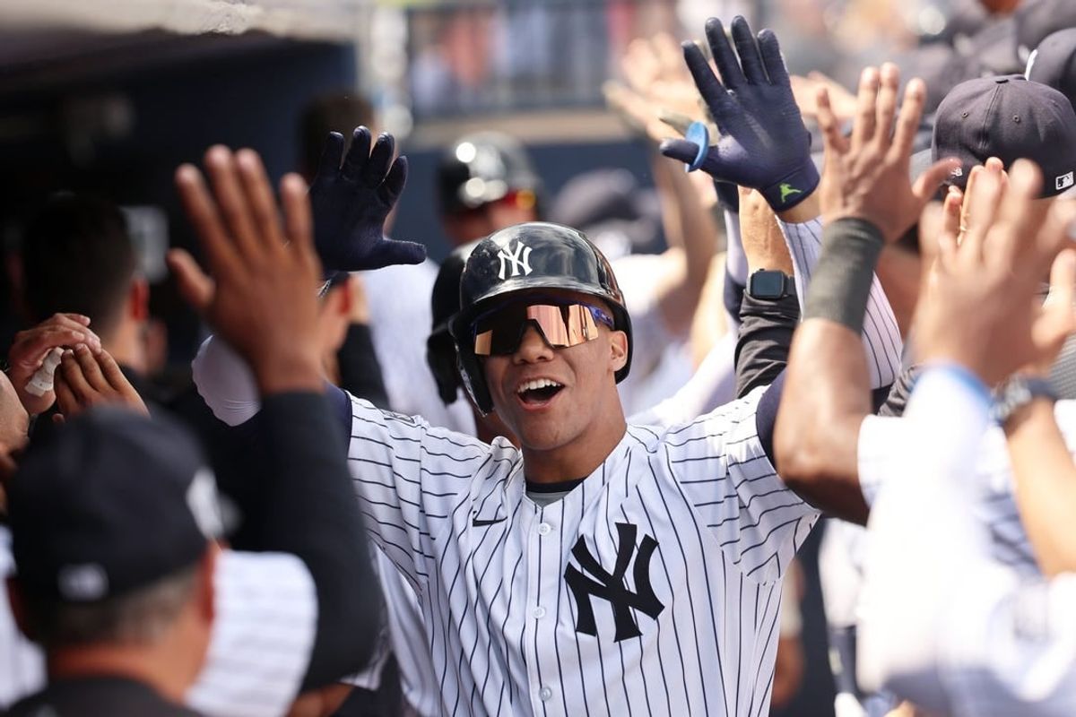 Mar 10, 2024; Tampa, Florida, USA;  New York Yankees left fielder Juan Soto (22) is congratulated after hitting a three run home run during the fourth inning  against the Atlanta Braves at George M. Steinbrenner Field.