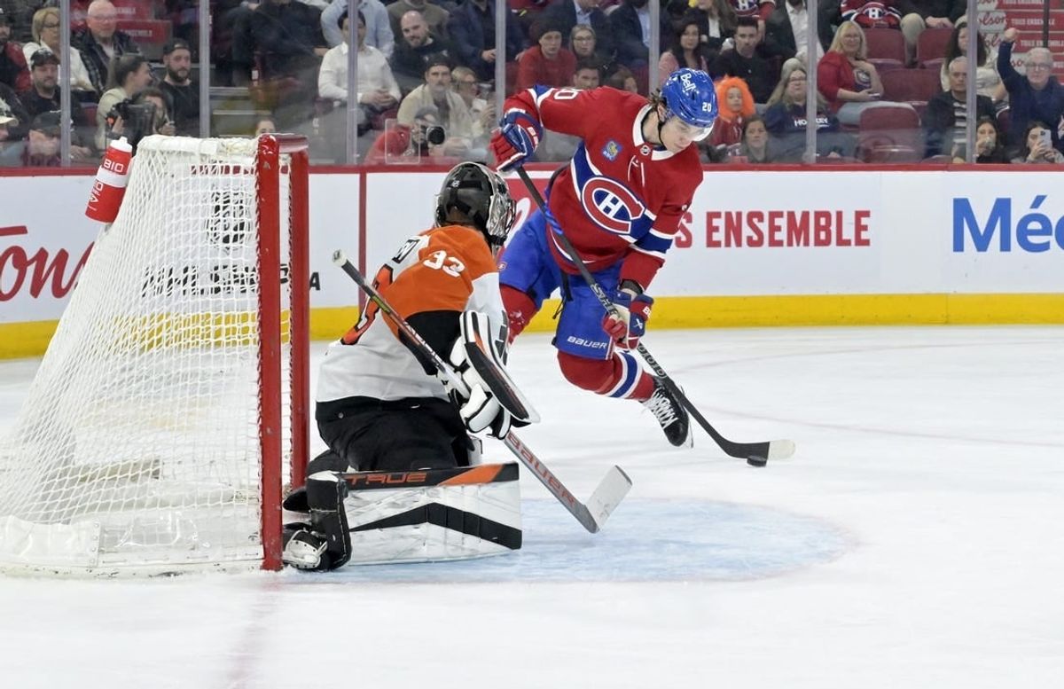 Apr 9, 2024; Montreal, Quebec, CAN; Montreal Canadiens forward Juraj Slafkovsky (20) scores a goal against Philadelphia Flyers goalie Samuel Ersson (33) during the second period at the Bell Centre.