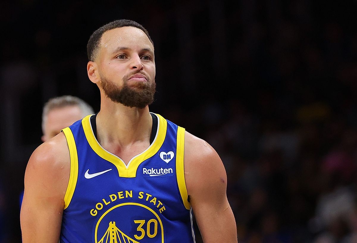 Stephen Curry of the Golden State Warriors reacts after hitting a three-point basket against the Atlanta Hawks during the fourth quarter at State Farm Arena on Feb. 3, 2024, in Atlanta, Georgia.