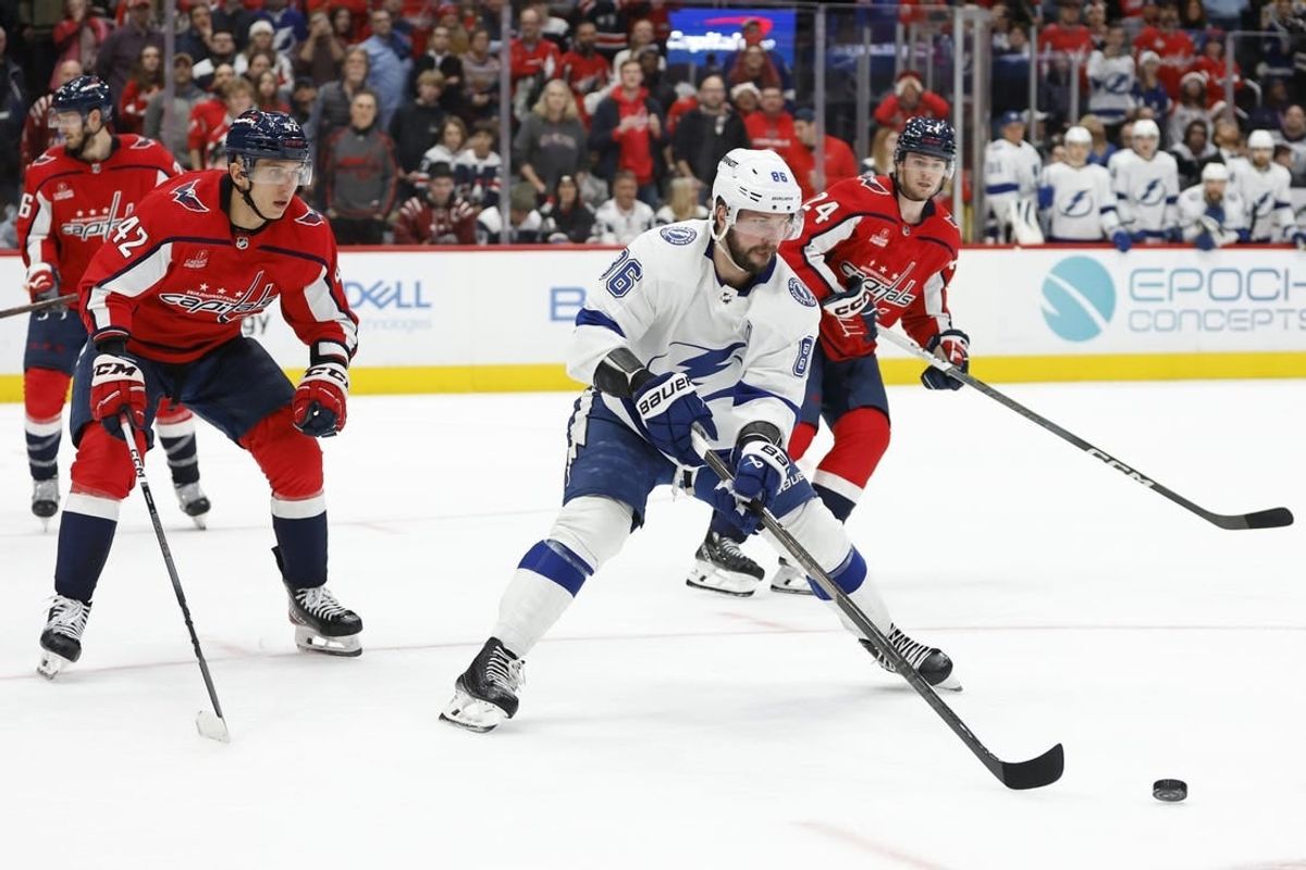 Dec 23, 2023; Washington, District of Columbia, USA; Tampa Bay Lightning right wing Nikita Kucherov (86) skates with the puck as Washington Capitals defenseman Martin Fehervary (42) defends in the second period at Capital One Arena.