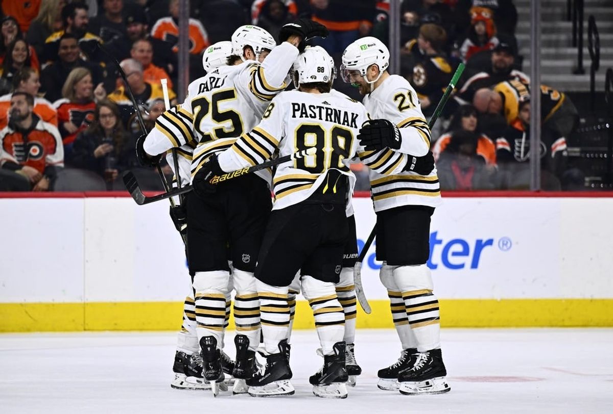 Jan 27, 2024; Philadelphia, Pennsylvania, USA; Boston Bruins right wing David Pastrnak (88) celebrates with teammates after scoring a goal against the Philadelphia Flyers in the first period at Wells Fargo Center.