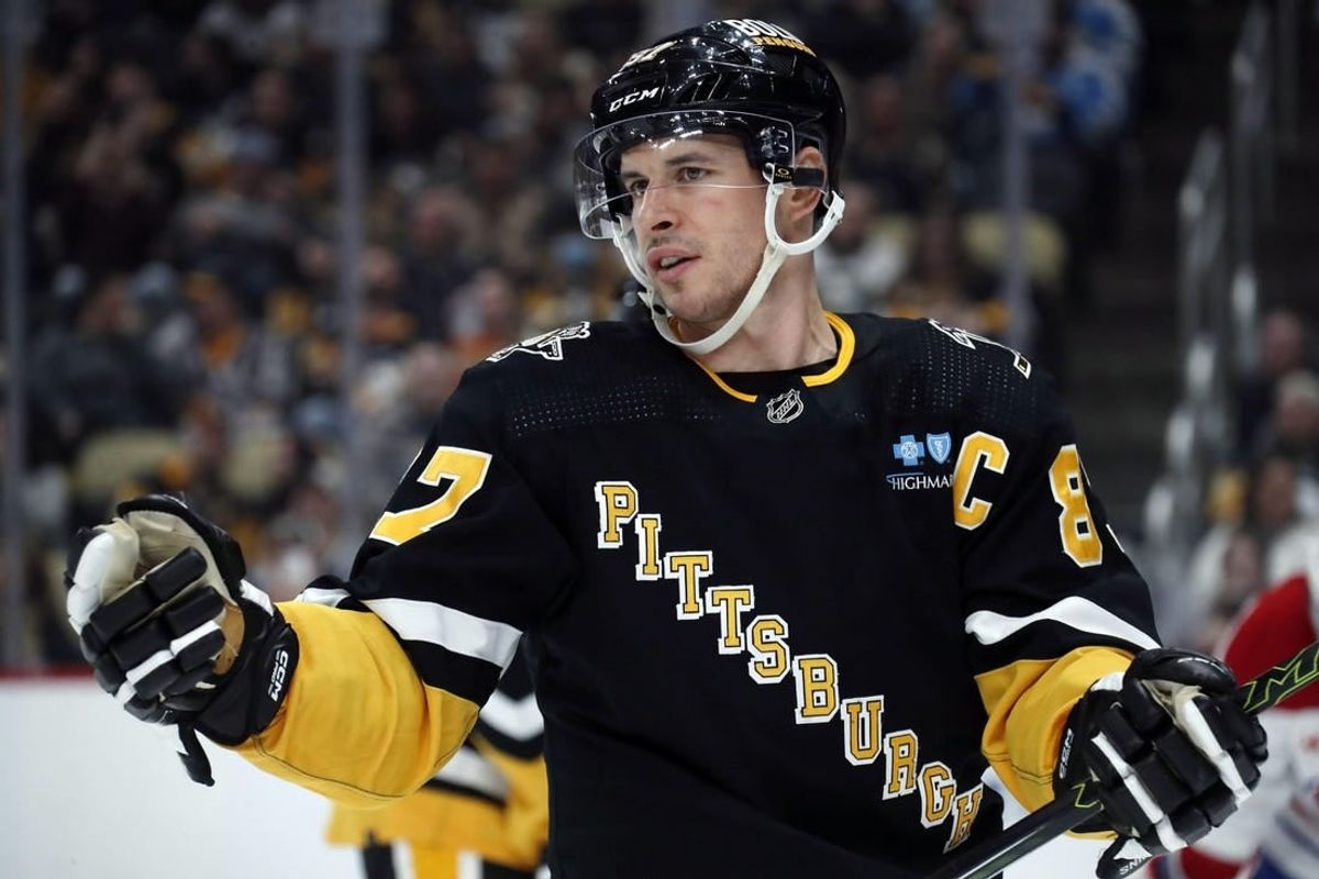 Feb 22, 2024; Pittsburgh, Pennsylvania, USA; Pittsburgh Penguins center Sidney Crosby (87) reacts on the ice against the Montreal Canadiens during the third period at PPG Paints Arena. The Penguins won 4-1.