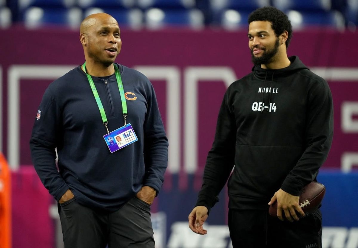 Mar 2, 2024; Indianapolis, IN, USA; Chicago Bears quarterbacks coach Kerry Joseph talks to Southern California quarterback Caleb Williams (QB14) during the 2024 NFL Combine at Lucas Oil Stadium.