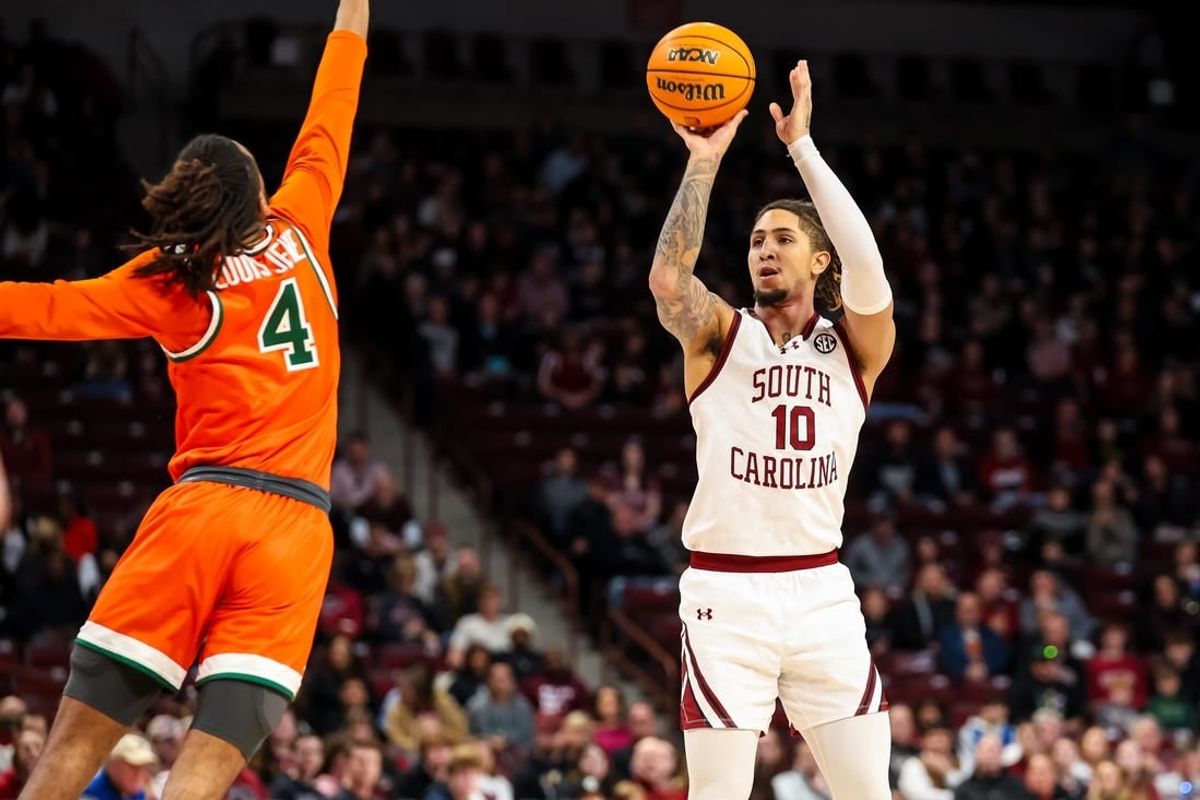 Dec 30, 2023; Columbia, South Carolina, USA; South Carolina Gamecocks guard Myles Stute (10) shoots over Florida A&M Rattlers guard Hantz Louis-Jeune (4) in the first quarter at Colonial Life Arena.