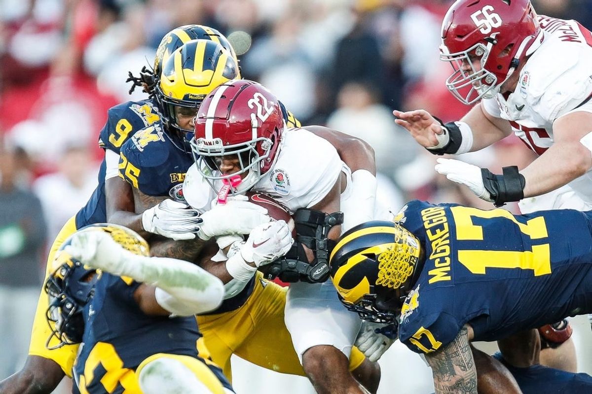 Alabama running back Justice Haynes (22) runs against Michigan defensive end Braiden McGregor (17) during the second half of the Rose Bowl in Pasadena, Calif., on Monday, Jan. 1, 2024.