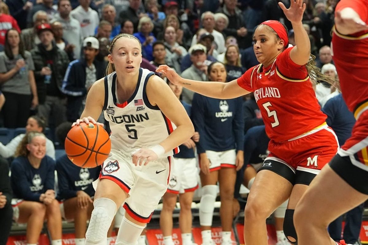 Nov 16, 2023; Storrs, Connecticut, USA; Connecticut Huskies guard Paige Bueckers (5) drives the ball toward the basket against Maryland Terrapins guard Brinae Alexander (5) during the second half at Harry A. Gampel Pavilion.