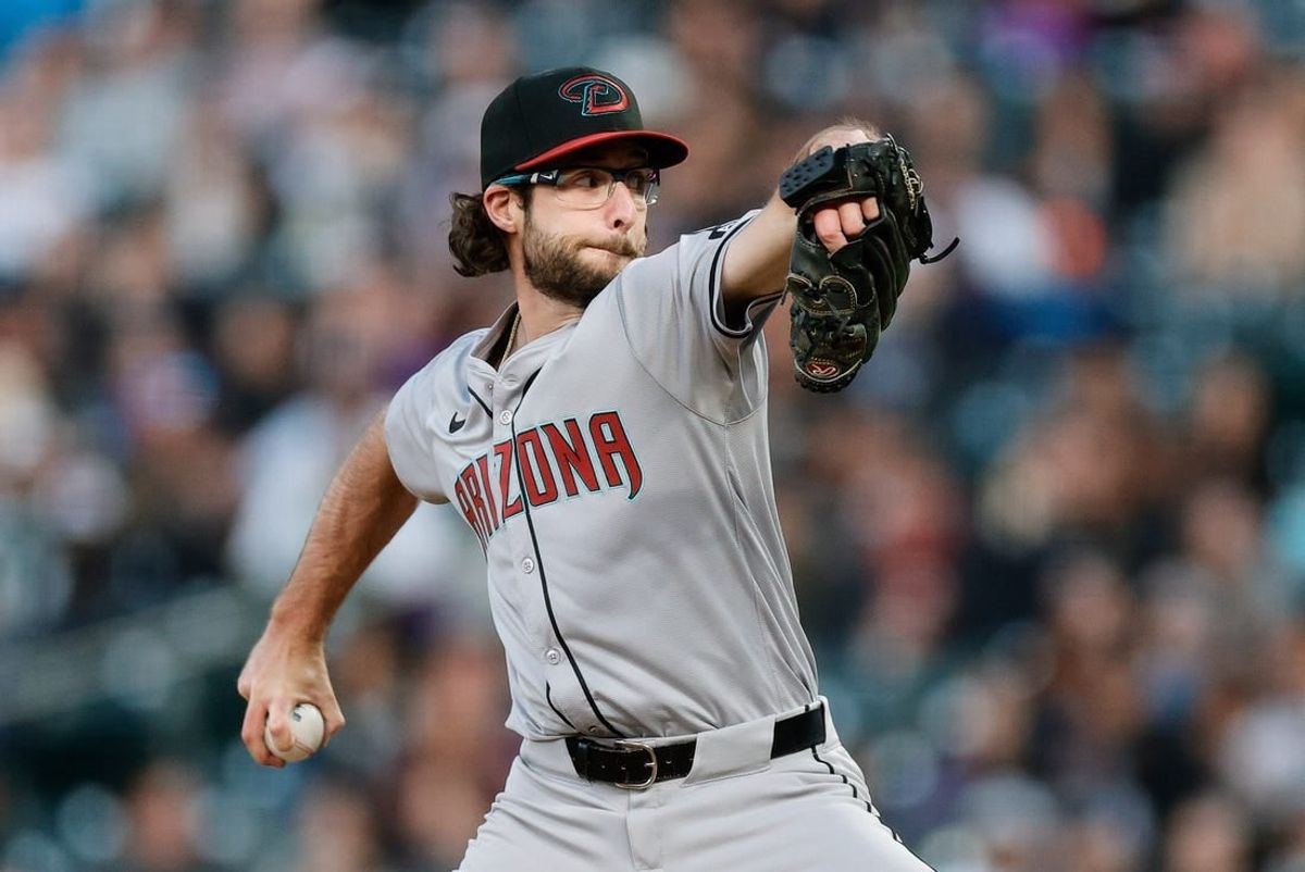 Apr 8, 2024; Denver, Colorado, USA; Arizona Diamondbacks starting pitcher Zac Gallen (23) pitches in the second inning against the Colorado Rockies at Coors Field.