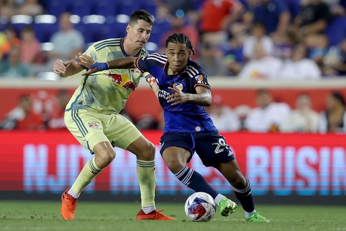 Jul 12, 2023; Harrison, New Jersey, USA; FC Cincinnati forward Arquimides Ordonez (29) controls the ball against New York Red Bulls defender Sean Nealis (15) during the second half at Red Bull Arena.