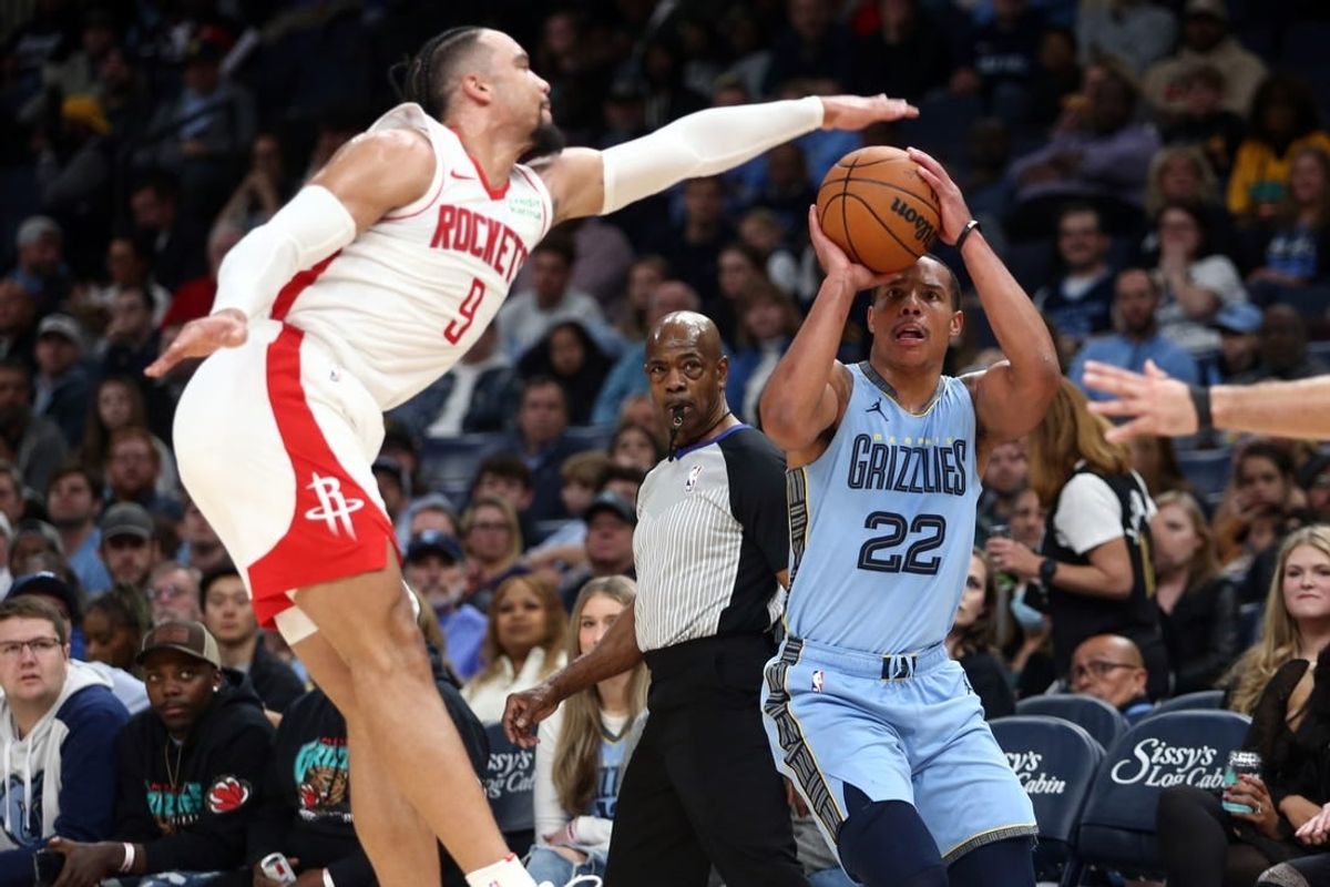 Dec 15, 2023; Memphis, Tennessee, USA; Memphis Grizzlies guard Desmond Bane (22) shoots for three as Houston Rockets  forward Dillon Brooks (9) defends during the first half at FedExForum.