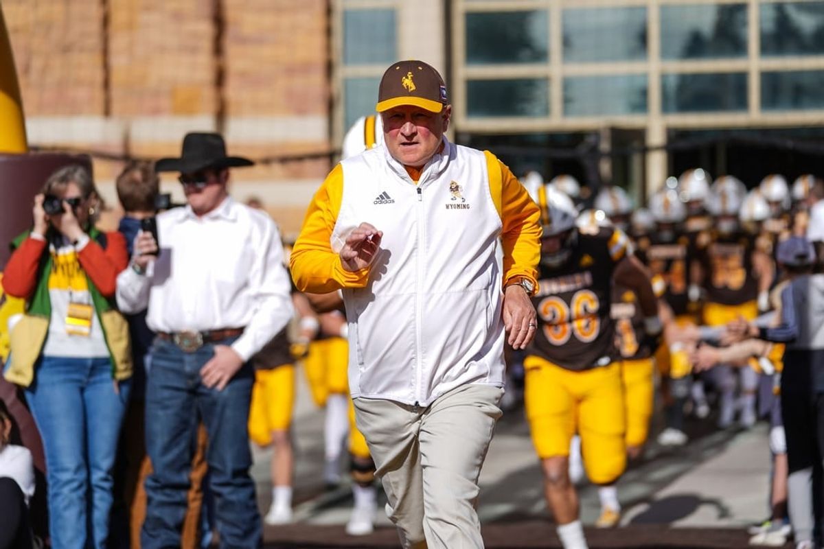 Nov 18, 2023; Laramie, Wyoming, USA; Wyoming Cowboys head coach Craig Bohl leads his team onto the field before the game against the Hawaii Rainbow Warriors at Jonah Field at War Memorial Stadium.