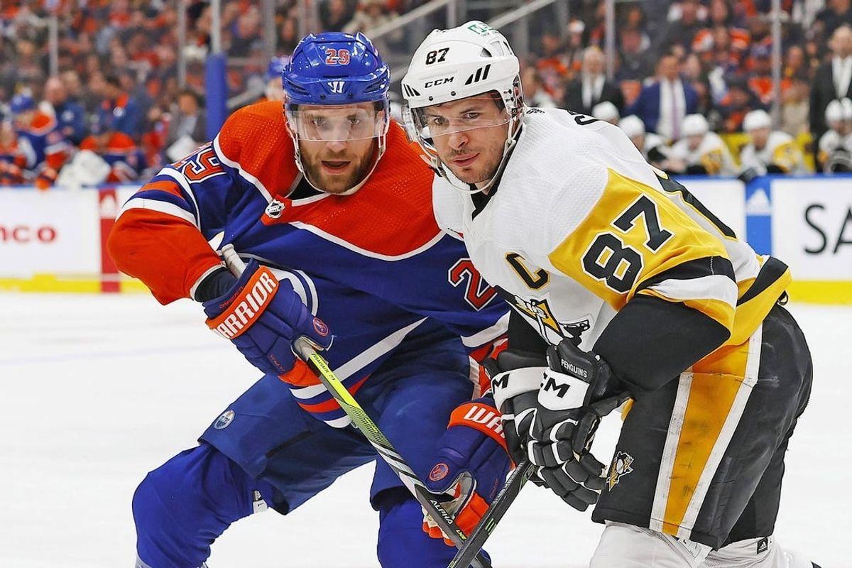 Mar 3, 2024; Edmonton, Alberta, CAN; Edmonton Oilers forward Leon Draisaitl (29) and Pittsburgh Penguins forward Sidney Crosby (87) look for a loose puck during the first period at Rogers Place.