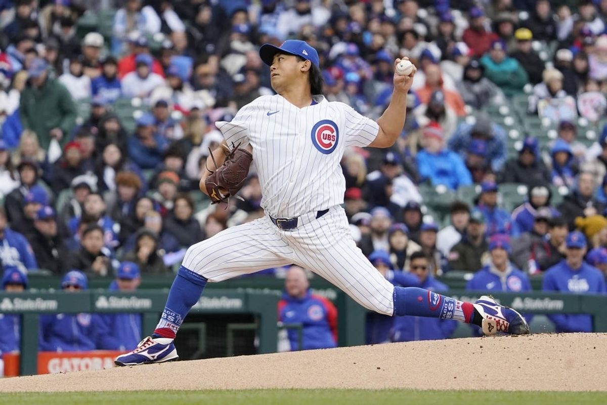 Apr 7, 2024; Chicago, Illinois, USA; Chicago Cubs pitcher Shota Imanaga (18) pitches against the Los Angeles Dodgers during the first inning at Wrigley Field.