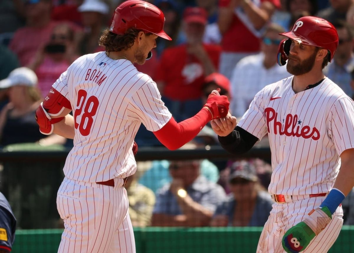 Feb 28, 2024; Clearwater, Florida, USA; Philadelphia Phillies infielder Alex Bohm (28) is congratulated by first baseman Bryce Harper (3) after he hit a two-run home run during the first inning against the Atlanta Braves  at BayCare Ballpark.