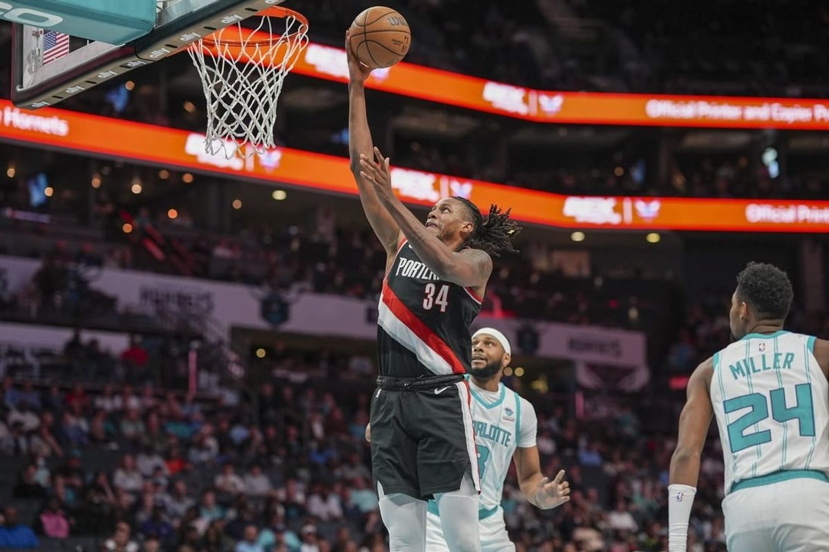 Apr 3, 2024; Charlotte, North Carolina, USA; Portland Trail Blazers forward Jabari Walker (34) goes to the rim against the Charlotte Hornets during the second quarter at Spectrum Center.