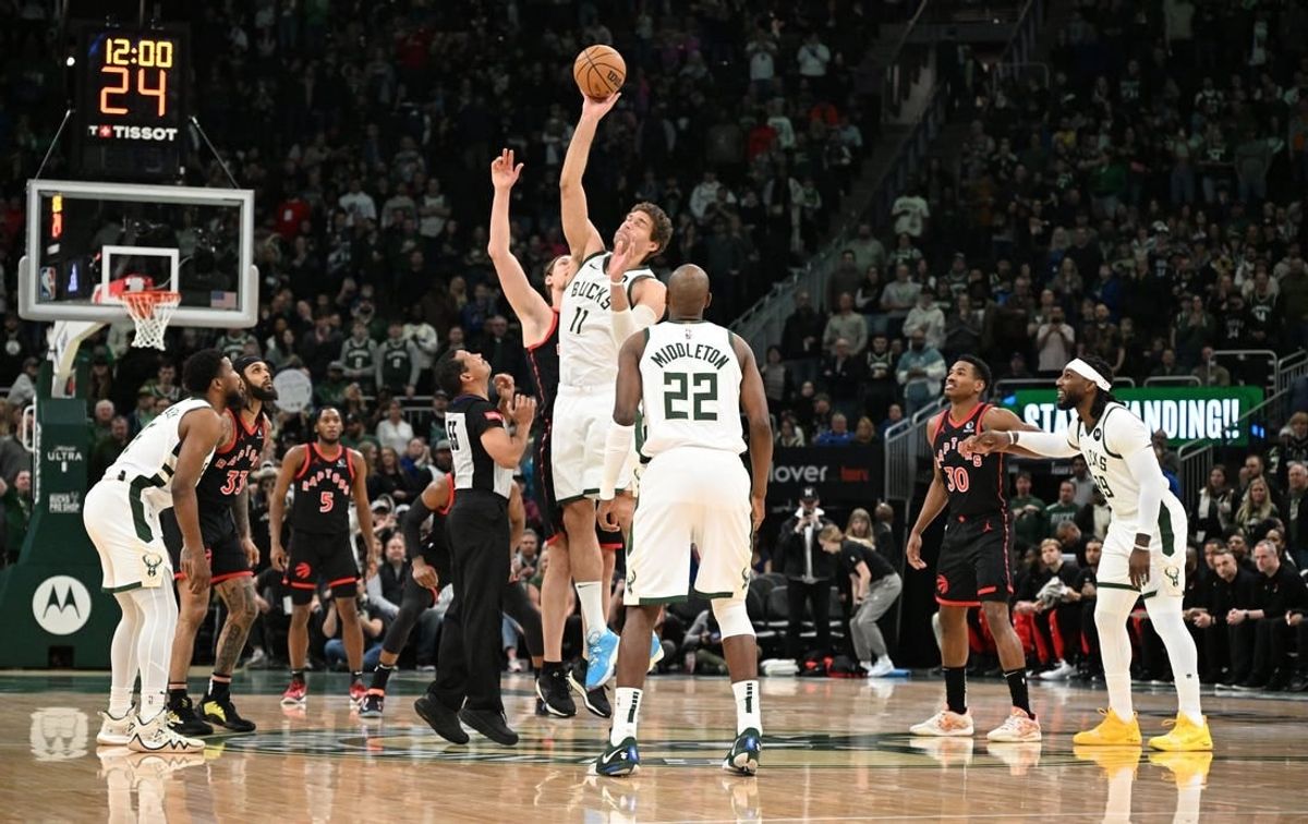 Apr 5, 2024; Milwaukee, Wisconsin, USA;  Milwaukee Bucks center Brook Lopez (11) gets the jump ball against Toronto Raptors at Fiserv Forum.