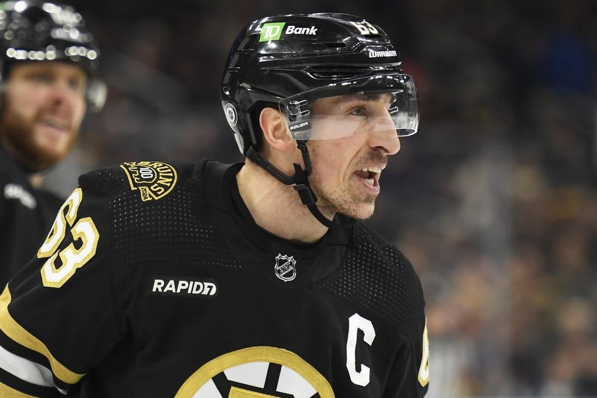 Jan 24, 2024; Boston, Massachusetts, USA;  Boston Bruins left wing Brad Marchand (63) has words for the refereee after being called for a penalty during the first period against the Carolina Hurricanes at TD Garden.