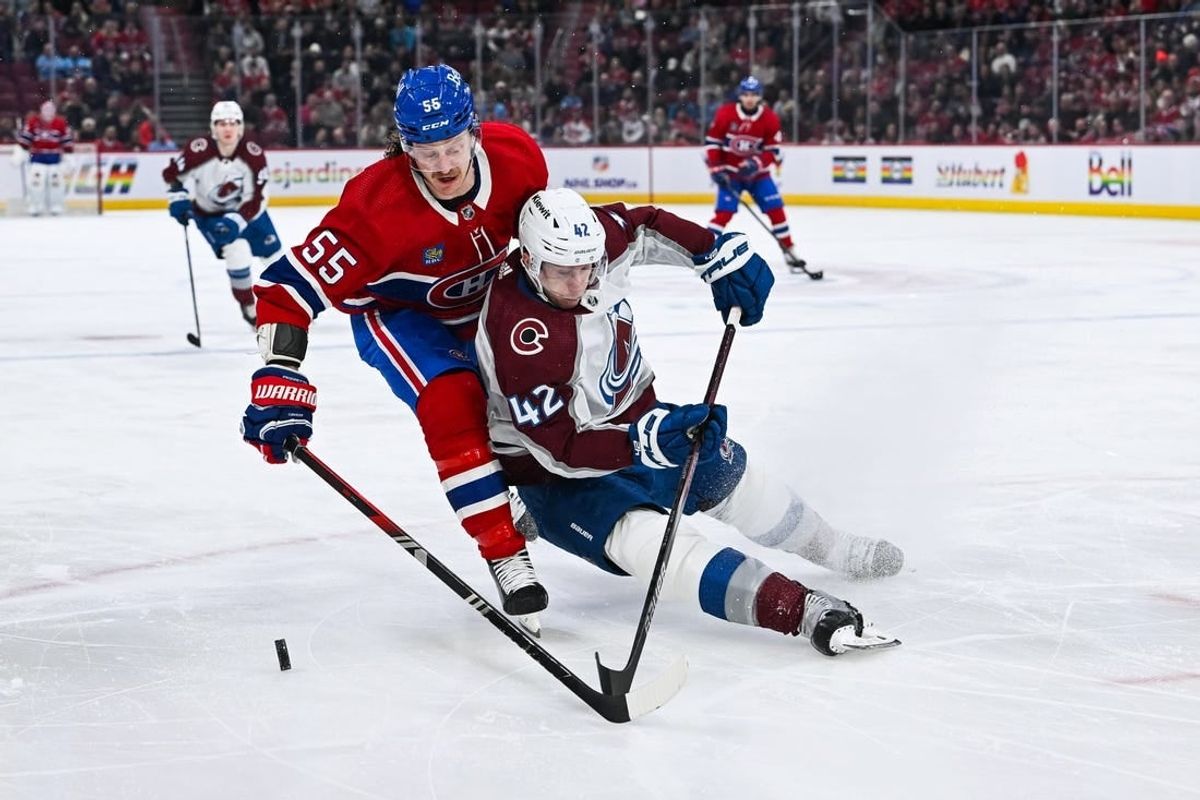 Jan 15, 2024; Montreal, Quebec, CAN; Colorado Avalanche defenseman Josh Manson (42) defends the puck against Montreal Canadiens left wing Michael Pezzetta (55) during the first period at Bell Centre.