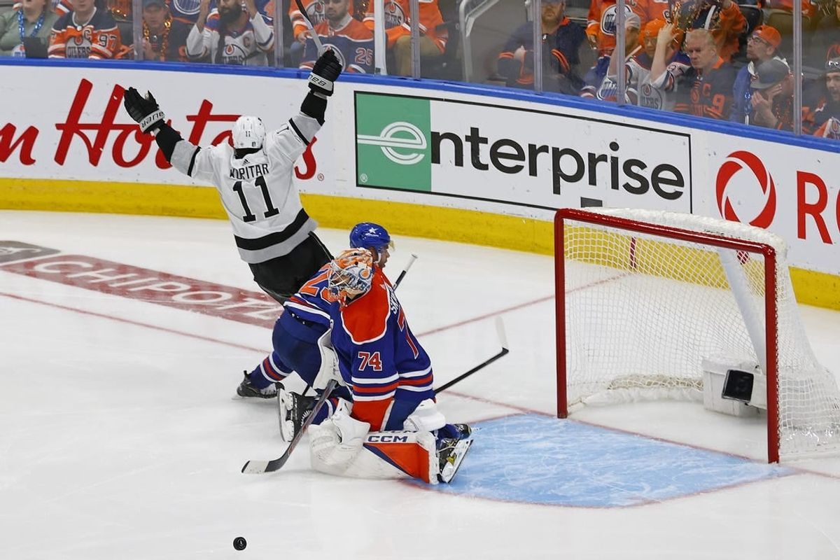 Apr 24, 2024; Edmonton, Alberta, CAN; Los Angeles Kings forward Anze Kopitar (11) scores the game winning goal during overtime against Edmonton Oilers goaltender Stuart Skinner (74) in game two of the first round of the 2024 Stanley Cup Playoffs at Rogers Place.