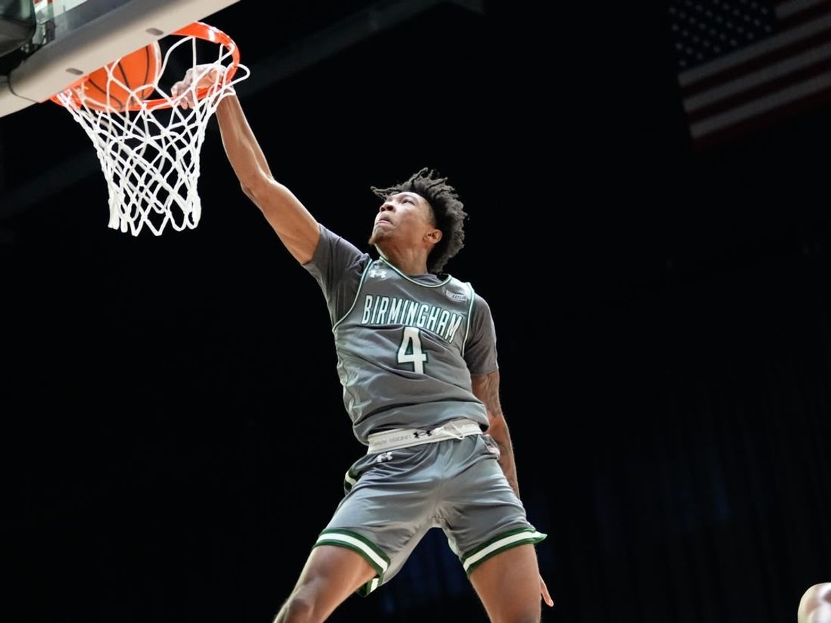 Mar 10, 2023; Frisco, TX, USA;  UAB Blazers guard Eric Gaines (4) dunks the ball against the North Texas Mean Green during the first half at Ford Center at The Star.