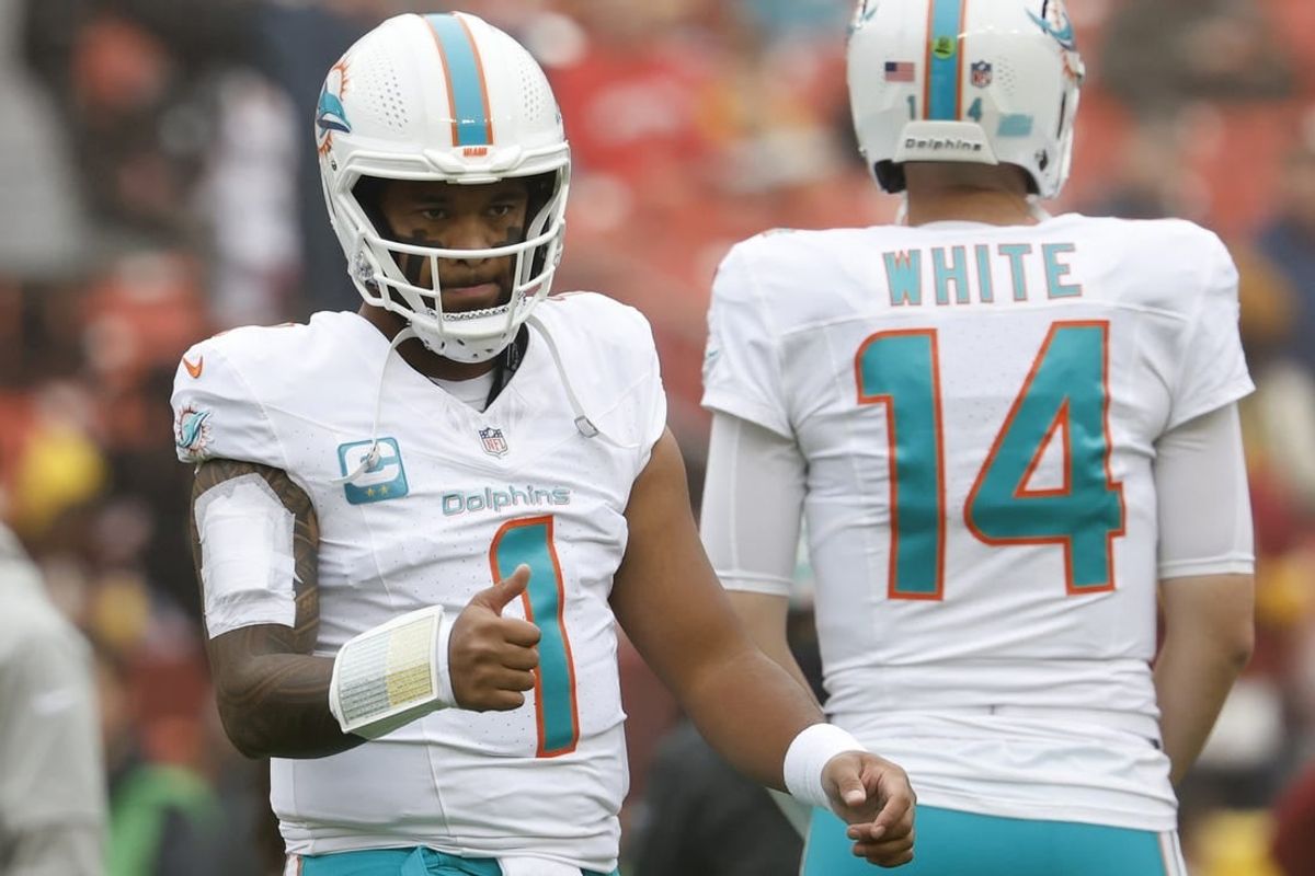 Dec 3, 2023; Landover, Maryland, USA; Miami Dolphins quarterback Tua Tagovailoa (1) stands on the field during warm up prior to the game against the Washington Commanders at FedExField.