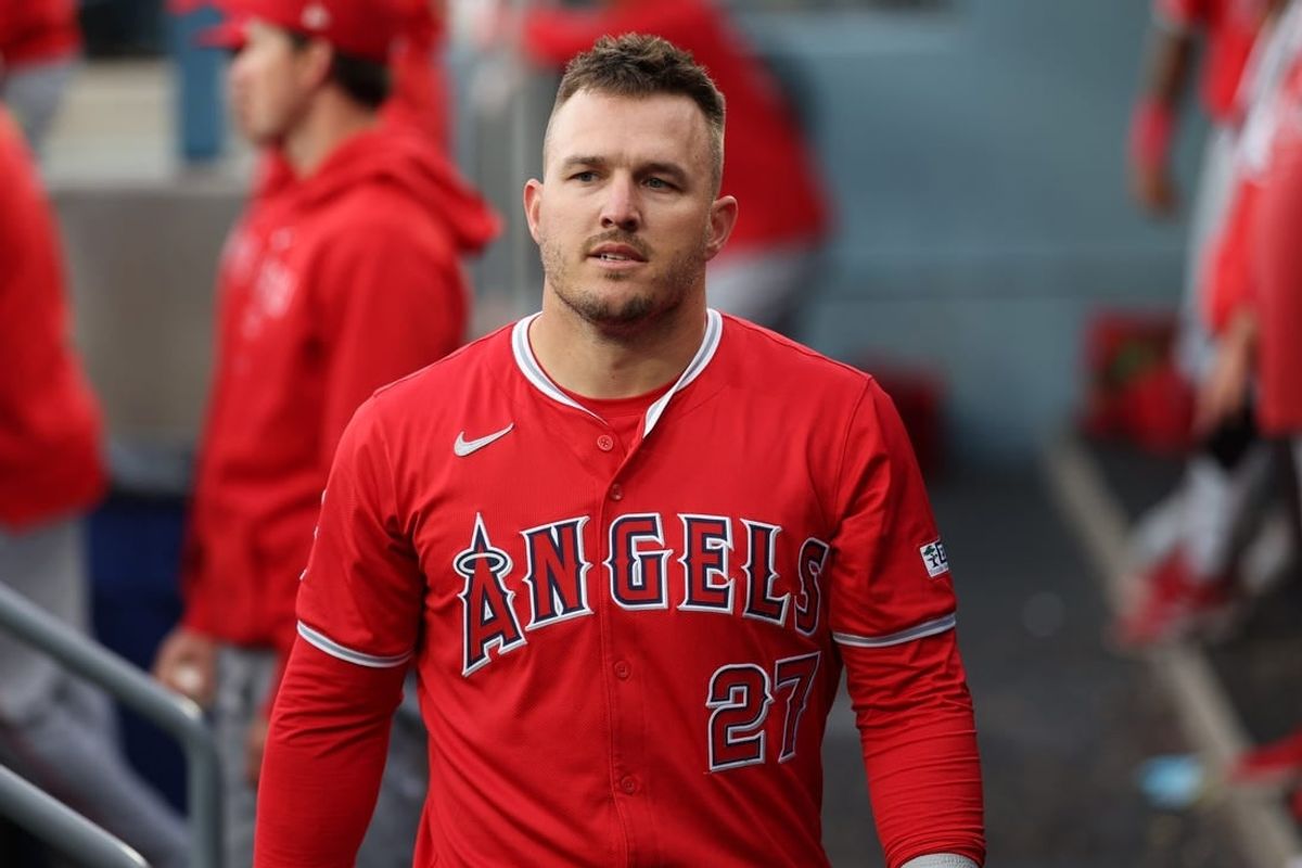 Mar 24, 2024; Los Angeles, California, USA; Los Angeles Angels center fielder Mike Trout (27) walks in the dugout during the game against the Los Angeles Dodgers at Dodger Stadium.