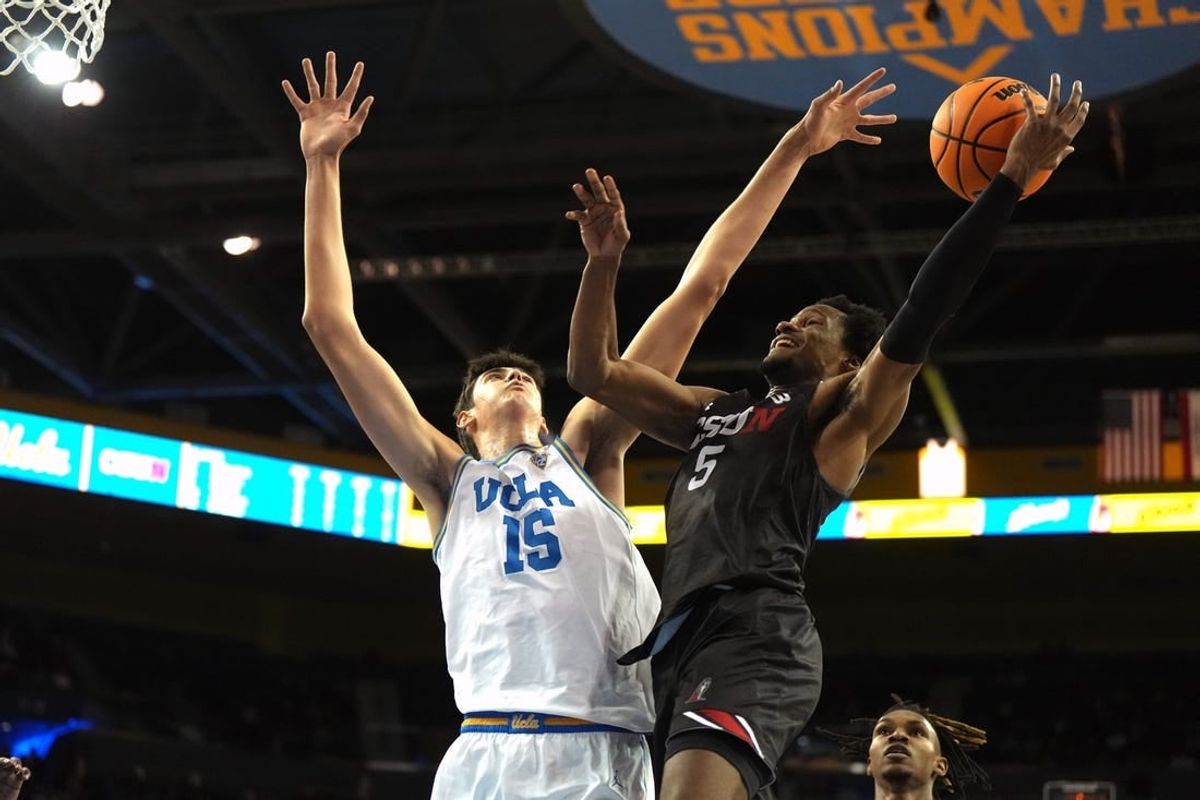 Dec 19, 2023; Los Angeles, California, USA; Cal State Northridge Matadors guard Gianni Hunt (5) shoots against UCLA Bruins center Aday Mara (15) in the first half at Pauley Pavilion presented by Wescom.