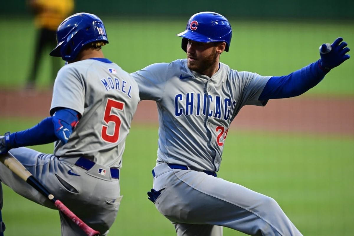 May 10, 2024; Pittsburgh, Pennsylvania, USA; Chicago Cubs designated hitter Cody Ballinger (24) is congratulated by third baseman Christopher Morel (5) after hitting a solo home run in the first inning against the Pittsburgh Pirates at PNC Park.