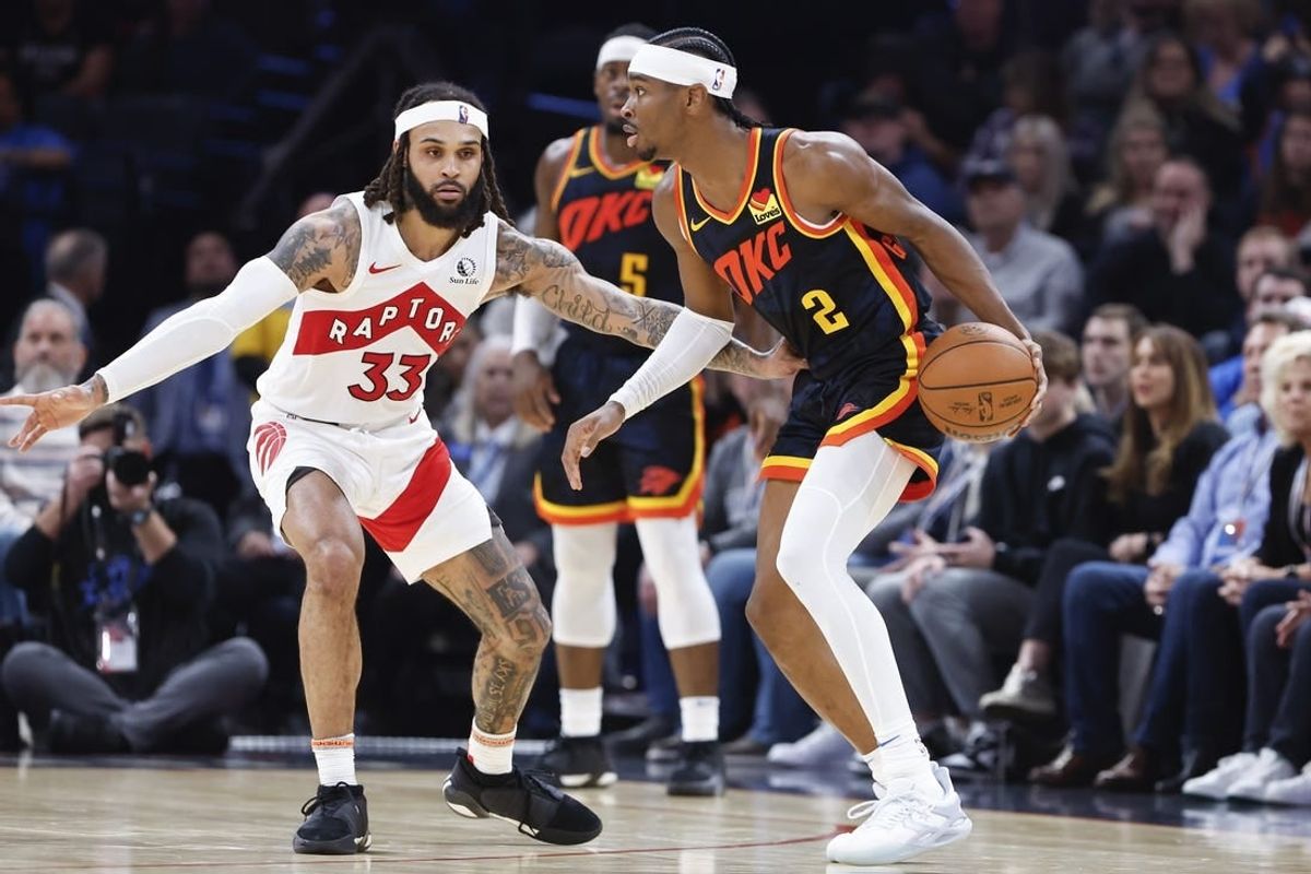 Feb 4, 2024; Oklahoma City, Oklahoma, USA; Oklahoma City Thunder guard Shai Gilgeous-Alexander (2) moves the ball against Toronto Raptors guard Gary Trent Jr. (33) during the second half at Paycom Center.