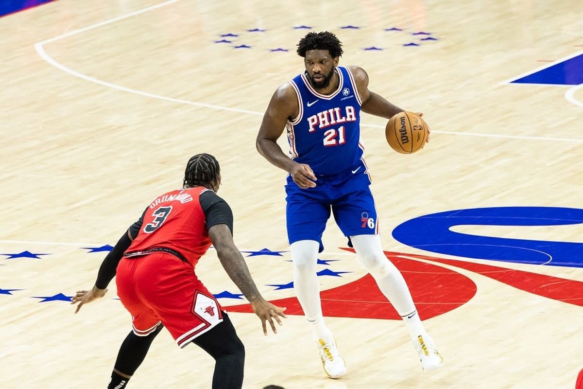 Jan 2, 2024; Philadelphia, Pennsylvania, USA; Philadelphia 76ers center Joel Embiid (21) controls the ball against Chicago Bulls center Andre Drummond (3) during the third quarter at Wells Fargo Center.