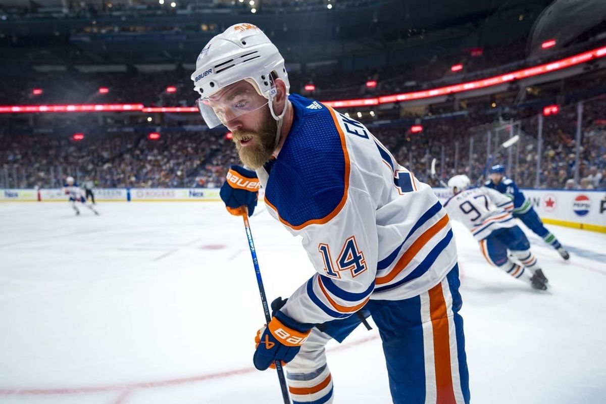 May 8, 2024; Vancouver, British Columbia, CAN; Edmonton Oilers defenseman Mattias Ekholm (14) looks for the loose puck against the Vancouver Canucks during the third period in game one of the second round of the 2024 Stanley Cup Playoffs at Rogers Arena.