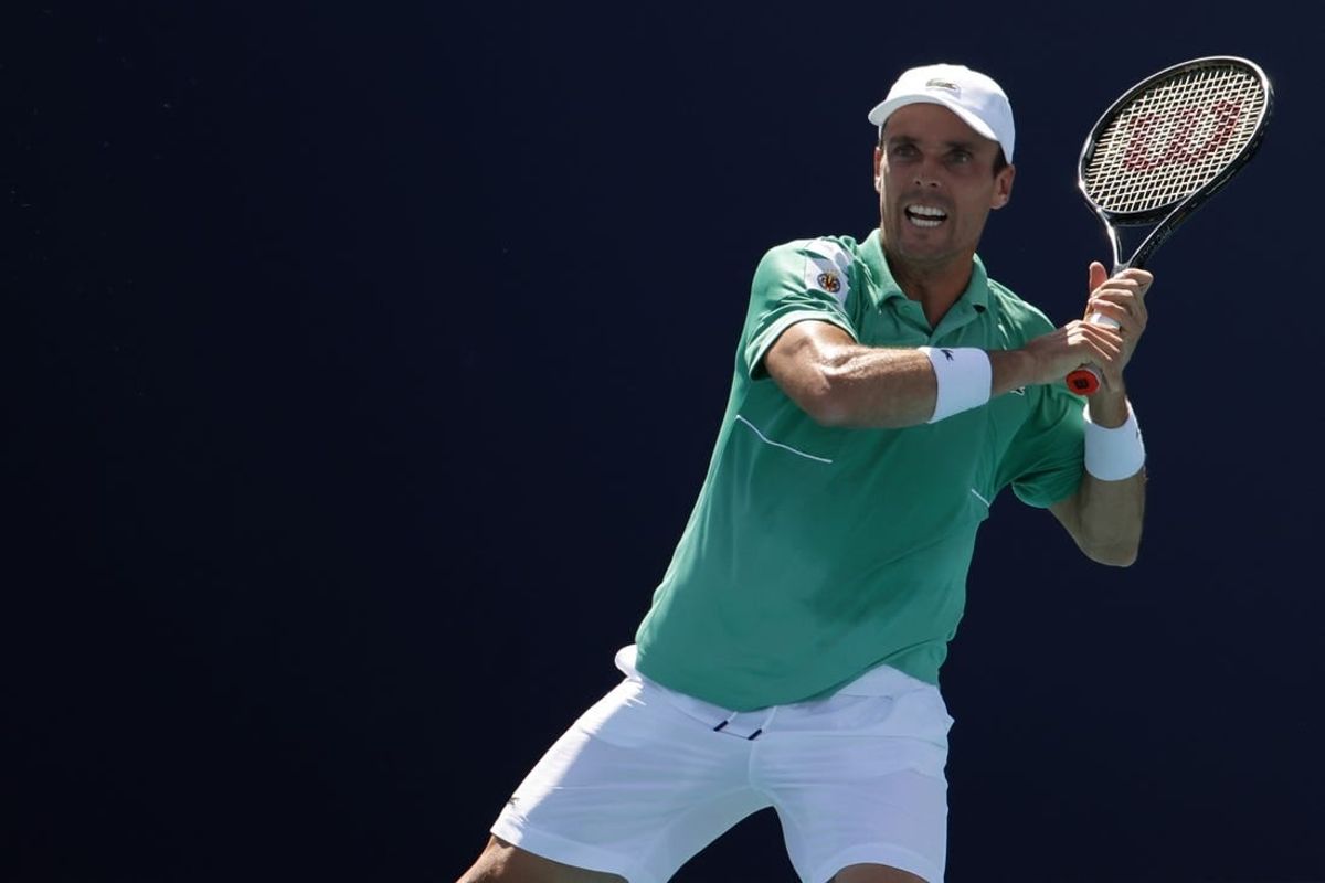 Mar 28, 2022; Miami Gardens, FL, USA; Roberto Bautista Agut (ESP) hits a forehand against Jenson Brooksby (USA)(not pictured) in a third round men's singles match in the Miami Open at Hard Rock Stadium.
