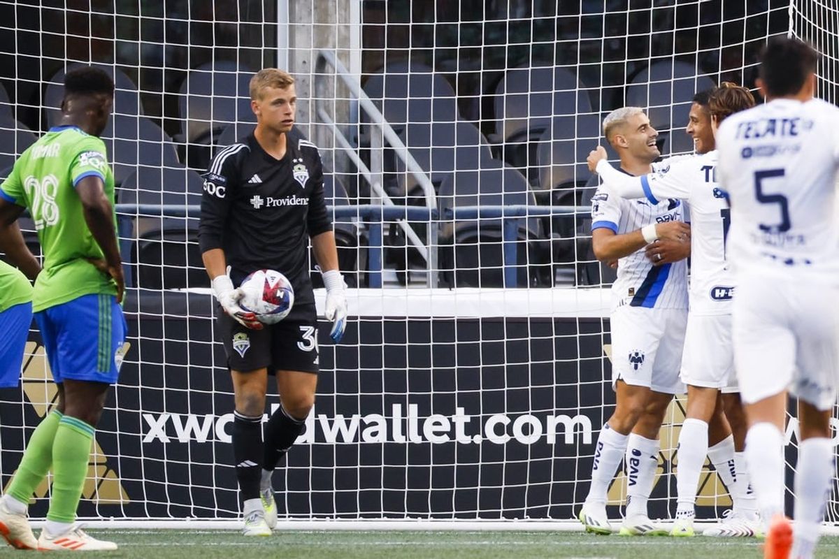 Jul 30, 2023; Seattle, WA, USA; Monterrey forward German Berterame (9, second from right) hugs defender Luis Romo (27) after scoring a goal against Seattle Sounders FC goalkeeper Stefan Cleveland (30) during the second half at Lumen Filed.