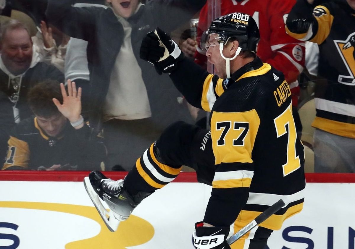 Dec 12, 2023; Pittsburgh, Pennsylvania, USA; Pittsburgh Penguins center Jeff Carter (77) reacts after scoring a short-handed goal against the Arizona Coyotes during the first period at PPG Paints Arena.