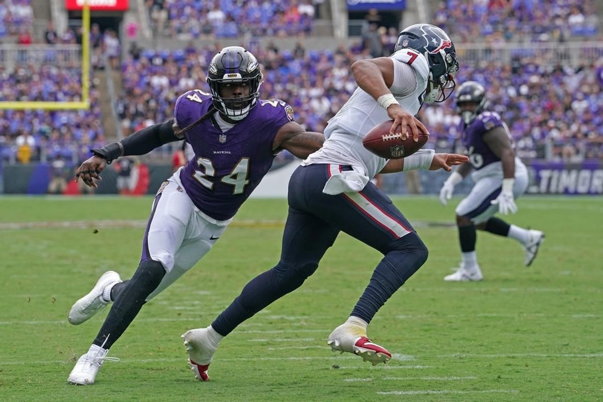 Baltimore Ravens Jadeveon Clowney linebacker (24) pressures Houston Texans quarterback C.J. Stroud (7) in the second quarter at M&T Bank Stadium.