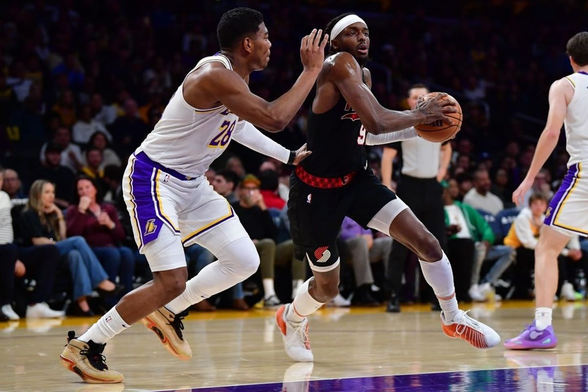 Jan 21, 2024; Los Angeles, California, USA; Portland Trail Blazers forward Jerami Grant (9) moves the ball against Los Angeles Lakers forward Rui Hachimura (28) during the first half at Crypto.com Arena.